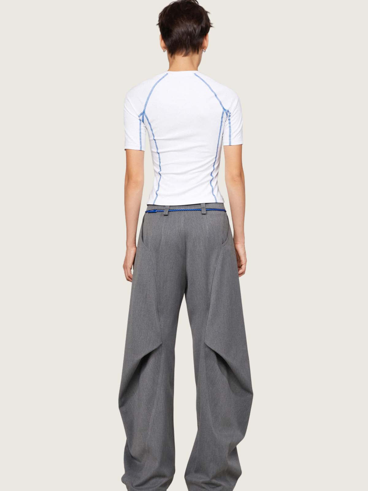 Grey pants with decorative folds